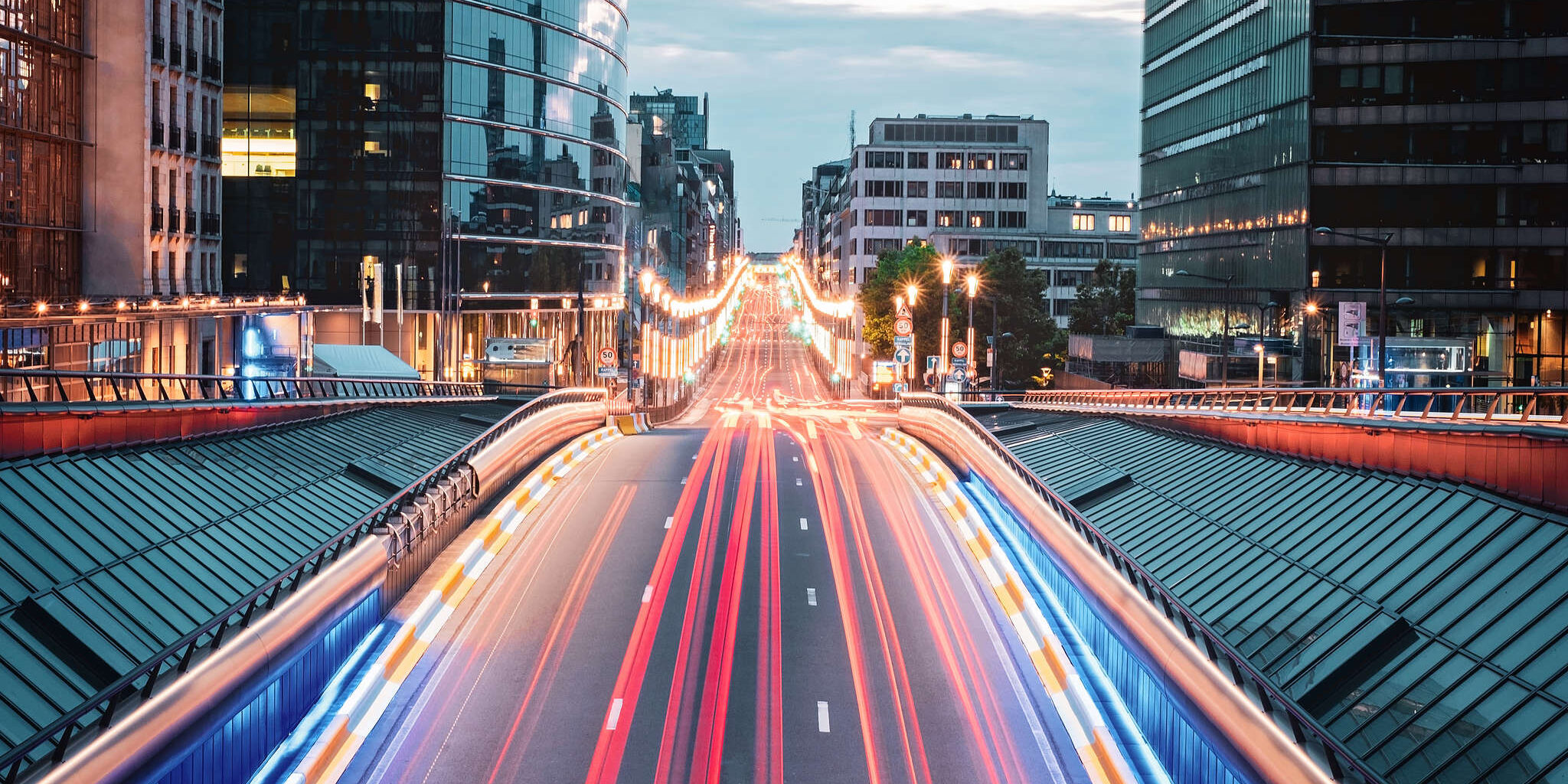 Long exposure shot from the bridge in Brussels, Belgium. Red traffic lights on the road