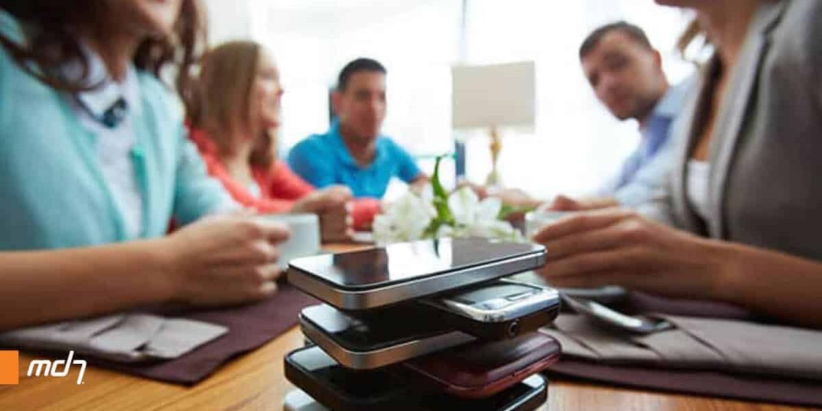 We Are Always Connected stack of mobile phones on table